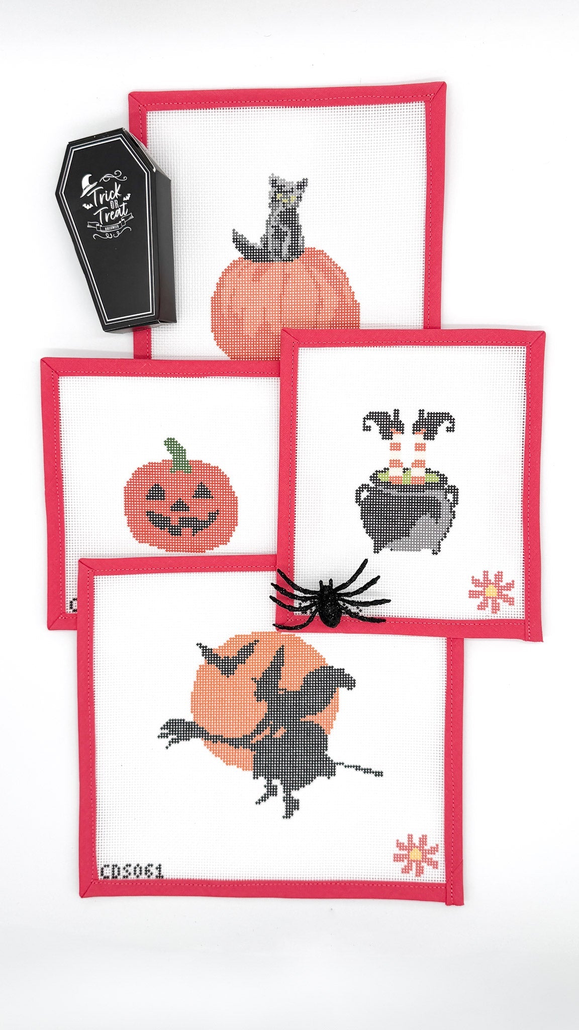 Halloween needlepoint canvas collection featuring witch and moon, black cat pumpkin, and cauldron designs