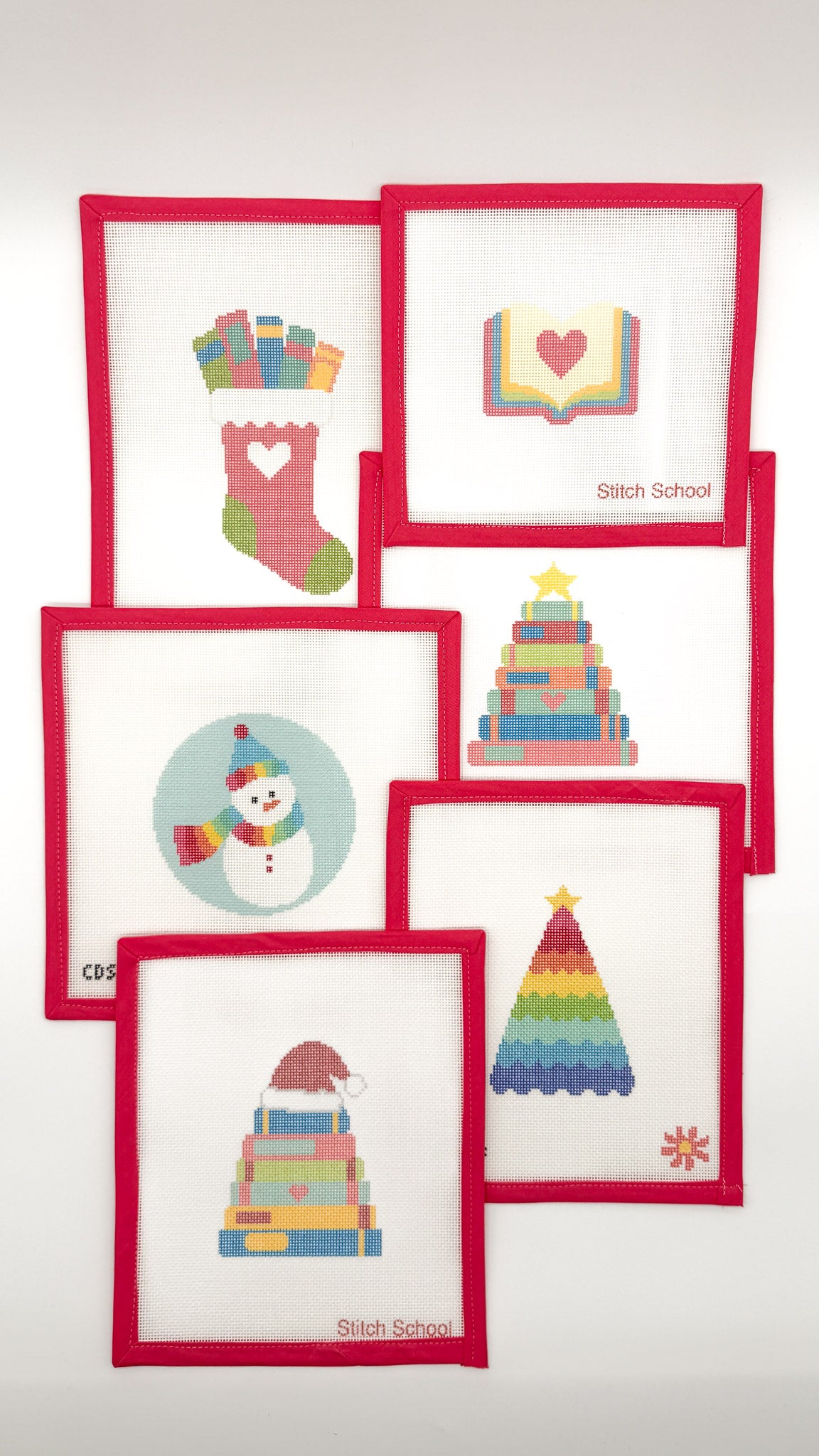 Stitch School Christmas needlepoint collection with colorful holiday canvases